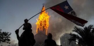 Violent protesters in Chile set the church on fire