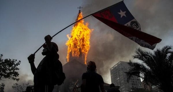 Violent protesters in Chile set the church on fire