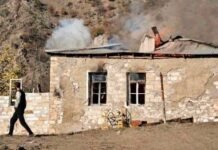 Nagorno-Karabakh people burning their own house in Armenia