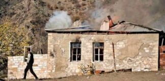 Nagorno-Karabakh people burning their own house in Armenia