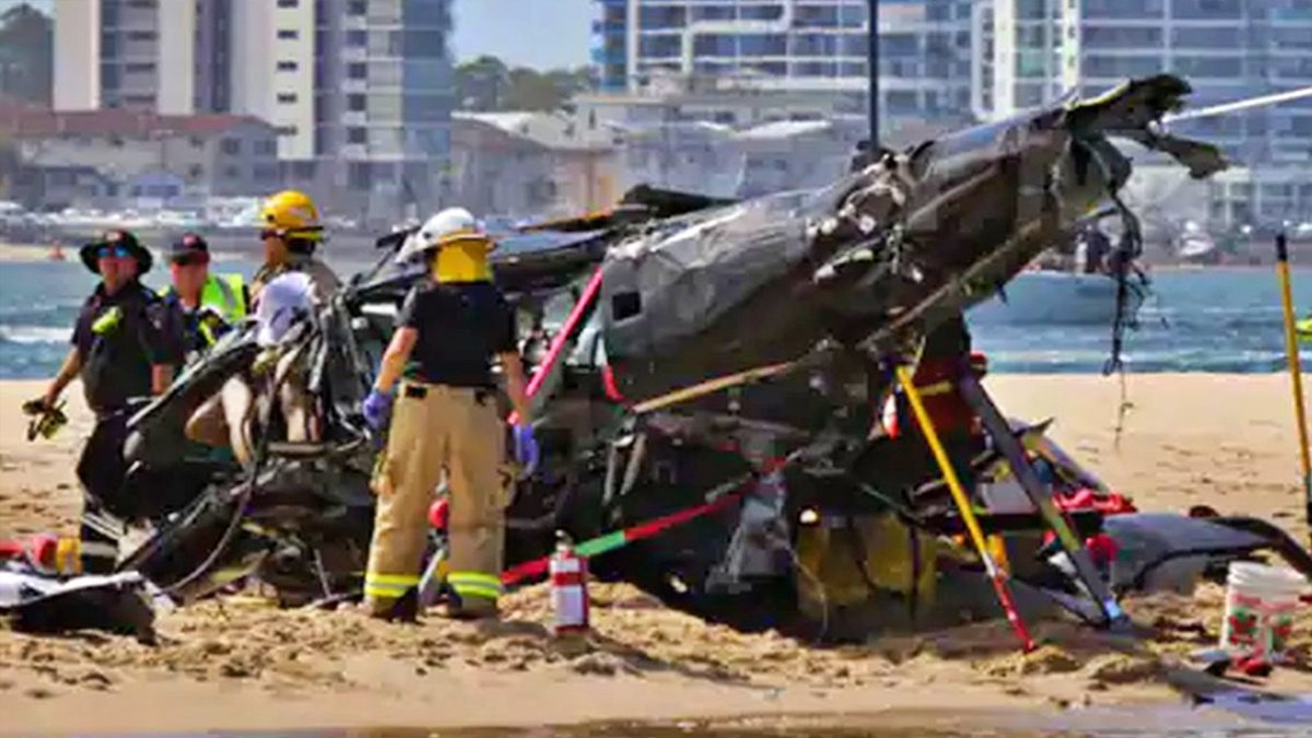 Helicopters collide over Australia beach, four killed