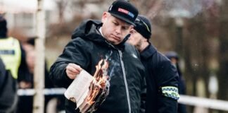 Swedens far-right leader burns Quran