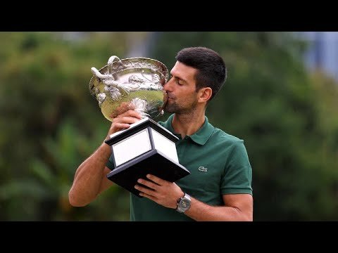 Novak Djokovic shows off trophy after Australian Open