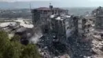 Excavators demolish damaged buildings in Turkey