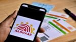 You can lock your Aadhaar Card by SMS