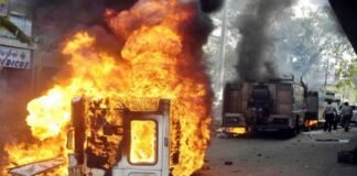 Mob sets ambulance on fire