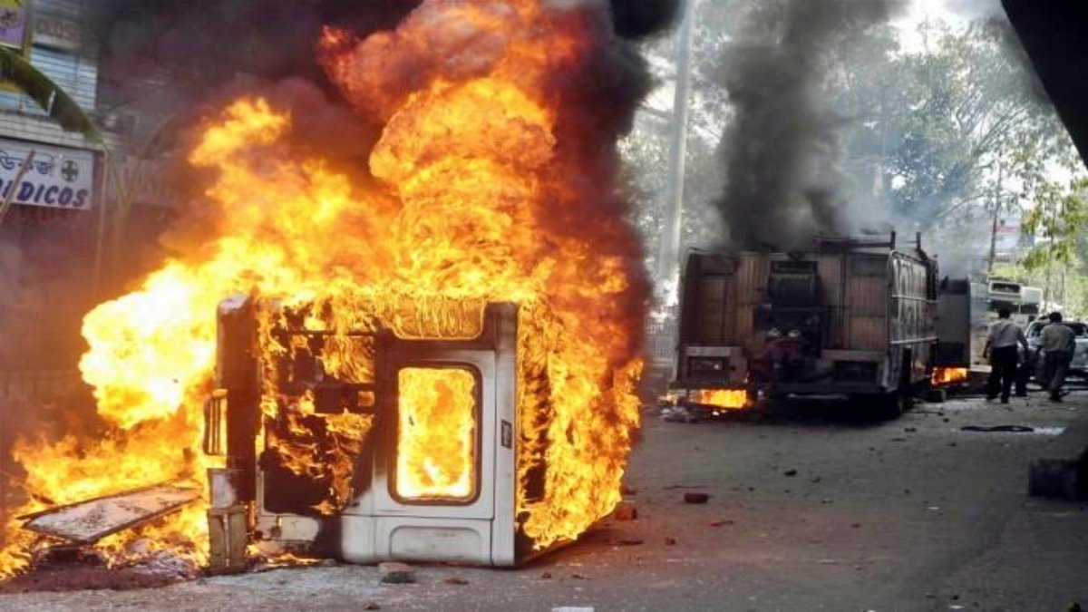 Mob sets ambulance on fire