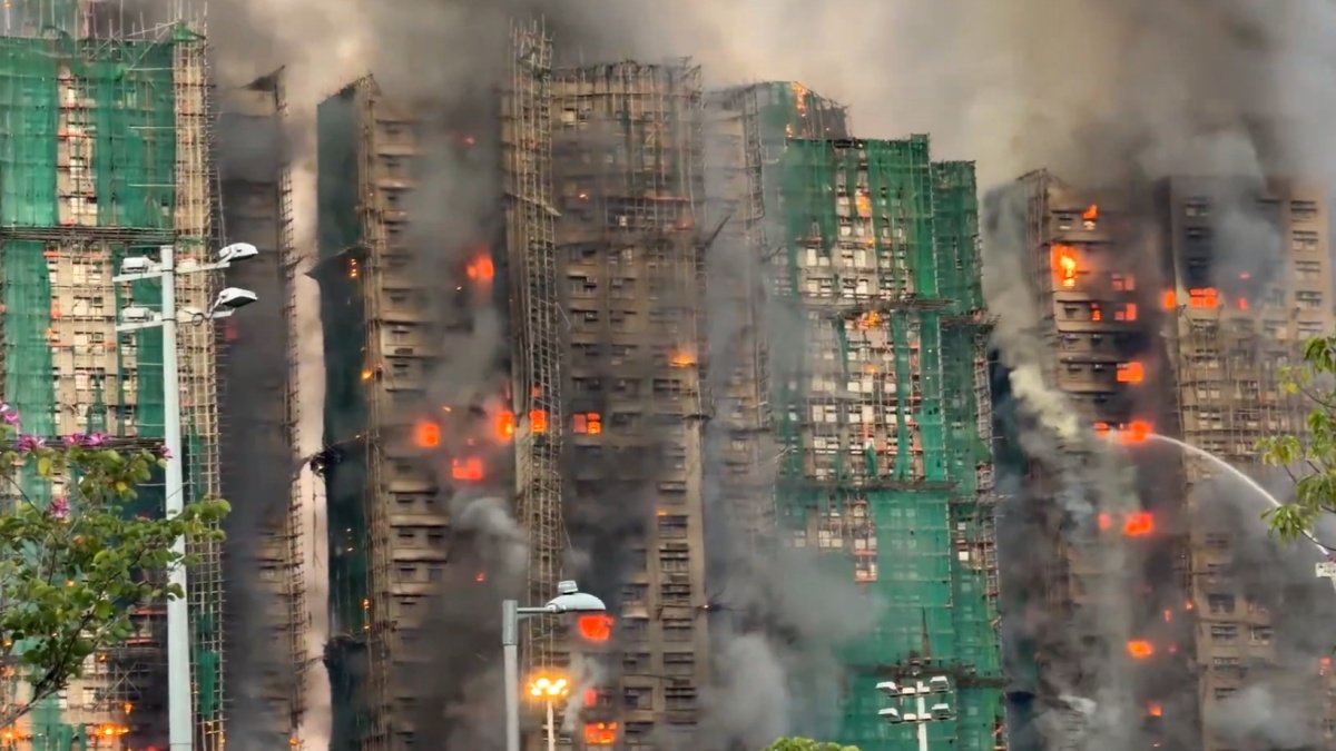HONG KONG FIRE TRAGEDY CLAIMS 94 LIVES IN WANG FUK COURT BLAZE